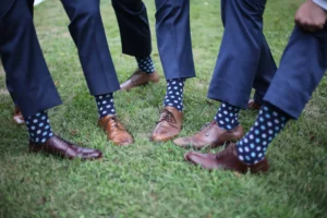 A group of men showing of their custom socks