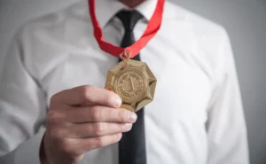 Man hold his medal around his neck