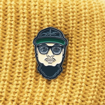 Custom lapel pin of a man wearing glasses
