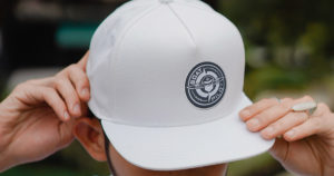 custom white hat with custom patch on it